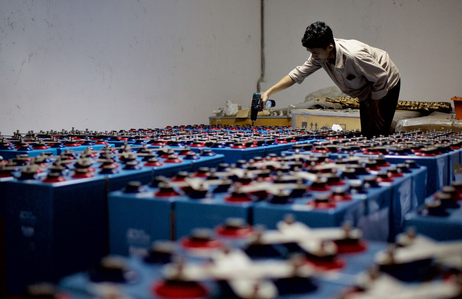 Rows of grid-scale lithium iron phosphate battery containers at a utility storage site
