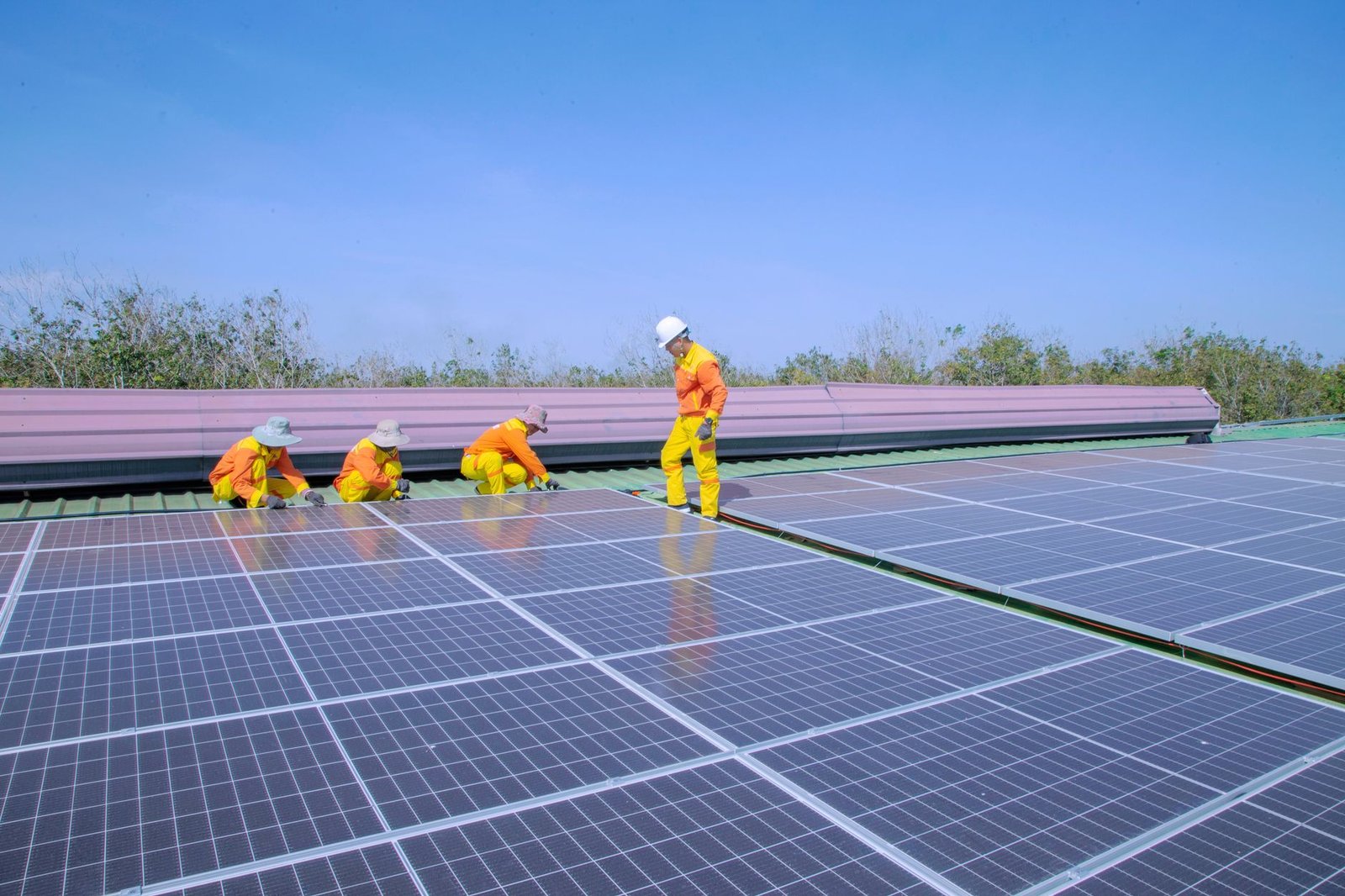 A utility-scale solar project under construction, with rows of mounting racks being installed