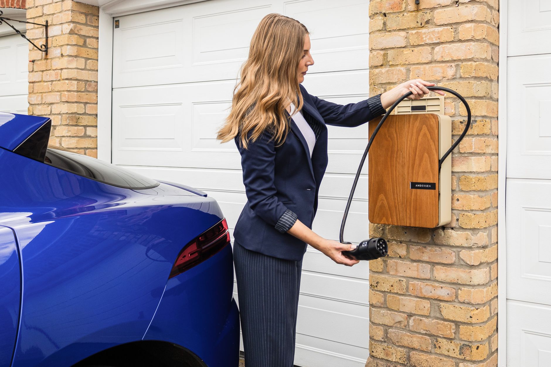 A wall-mounted home battery unit in a garage