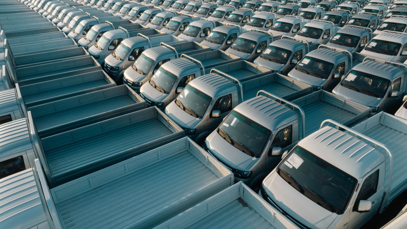 A row of new electric cars awaiting delivery