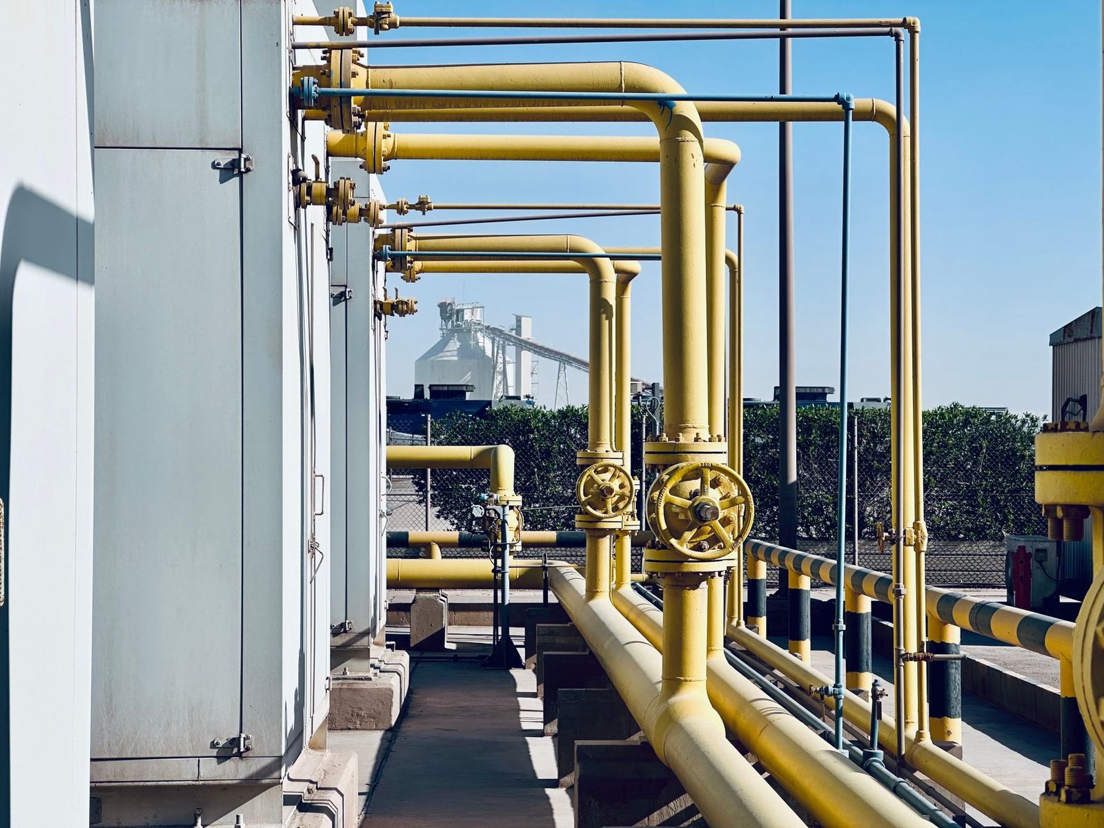 Rows of modular gas generator units outside a large data centre building